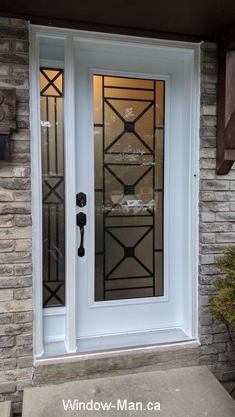 Front door. With frame to grame sidelight. Century wrought Irong glasses